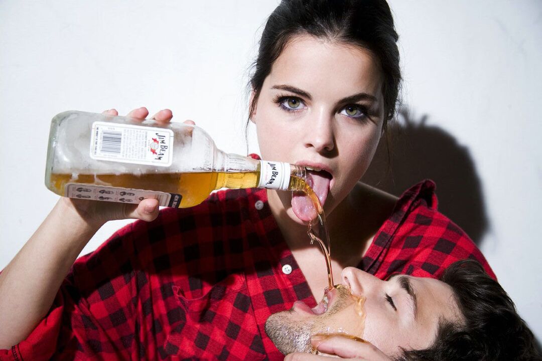 a girl pours alcohol to a man before sex